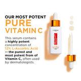 L'Oréal Paris Revitalift Clinical vitamin C serum in a white bottle with orange dropper cap, shown with its applicator