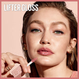 Maybelline Lifter Gloss in a pale pink tube with a white wand and rosy gloss, shown applied on glossy lips
