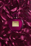 Antonio Banderas Her Secret Temptation perfume bottle on satin ribbons