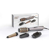 BaByliss 4 in 1 Hair Dryer Styler in metallic rose gold with interchangeable round brush, curling, and paddle attachments
