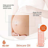 Bio-Oil Skincare Oil bottle in a pink and white design beside a pregnant belly, with stretch mark care messaging