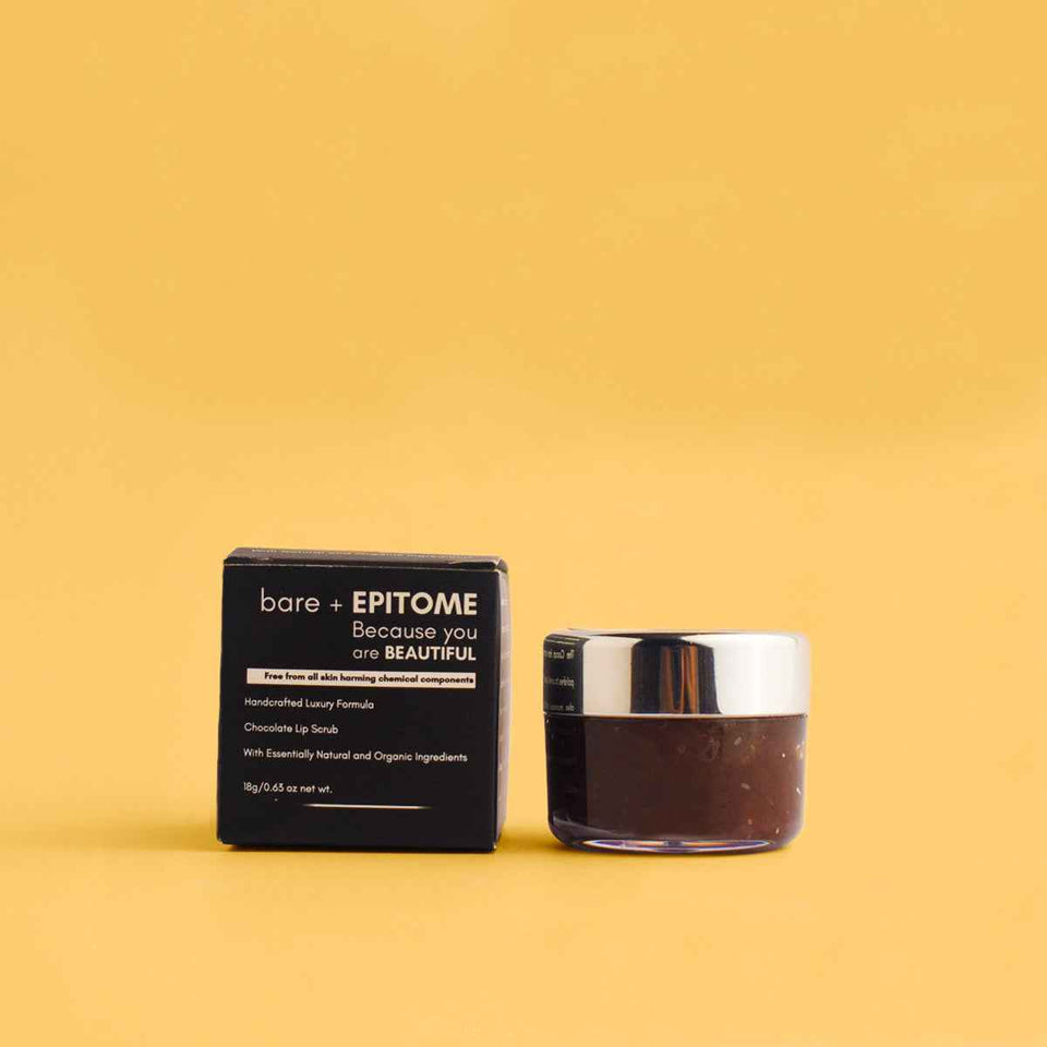 Chocolate Lip Scrub in a dark brown jar with a silver lid beside a black carton with white lettering.
