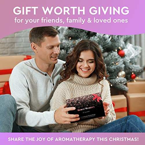Couple exchanging Cleverfy shower steamers gift set by Christmas tree