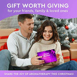 Couple exchanging Cleverfy Shower Steamers aromatherapy gift set by Christmas tree