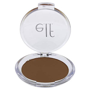 e.l.f. Prime & Stay Finishing Powder in a clear round compact, showing smooth medium-brown pressed powder and e.l.f. logo