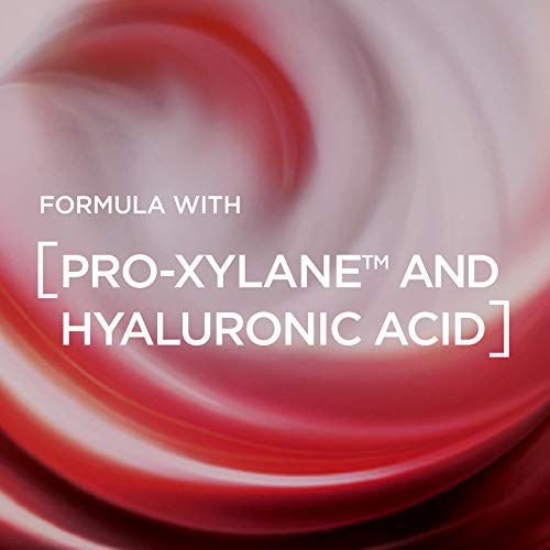 L’Oreal Revitalift Eye Cream with a glossy red and pink cream swirl, highlighting Pro-Xylane and hyaluronic acid