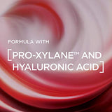 L’Oreal Revitalift Eye Cream with a glossy red and pink cream swirl, highlighting Pro-Xylane and hyaluronic acid