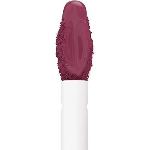 Maybelline Superstay Matte Ink liquid lipstick applicator with deep berry-plum color coating and a white handle