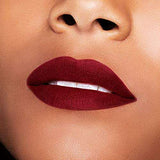 Maybelline Superstay Matte Ink lipstick on lips, deep burgundy matte colour with a smooth, richly pigmented finish