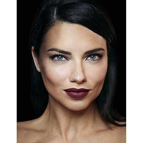 Maybelline Superstay Matte Ink lipstick shown on a model with deep burgundy matte colour on her lips.