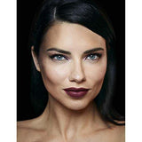 Maybelline Superstay Matte Ink lipstick shown on a model with deep burgundy matte colour on her lips.