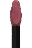 Maybelline Superstay Matte Ink liquid lipstick swatch in a muted dusty rose nude, with a smooth creamy finish.
