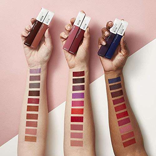 Maybelline Superstay Matte Ink liquid lipstick tubes in brown, rose and blue, with rows of colorful lip swatches on arms
