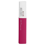 Maybelline Superstay Matte Ink liquid lipstick in a vivid magenta tube with a white cap and printed branding