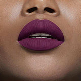 Maybelline Superstay Matte Ink liquid lipstick shown on lips in a rich matte plum shade with a smooth, opaque finish