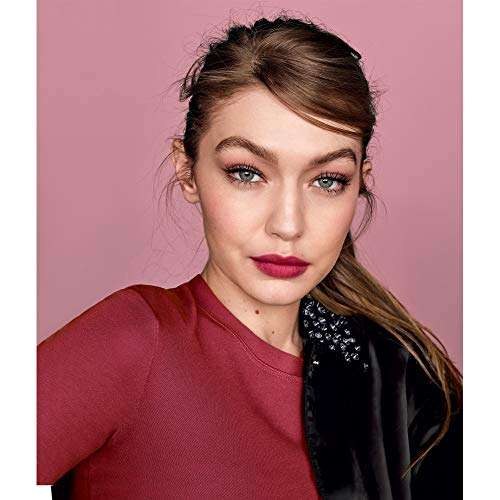Maybelline Superstay Matte Ink lipstick shown on a model with deep berry-red lips and a matte finish