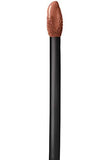 Maybelline Superstay Matte Ink lipstick applicator with a black handle and nude-brown liquid lipstick on its tip