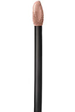 Maybelline Superstay Matte Ink nude liquid lipstick applicator with a black handle and beige-pink product on the tip