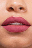 Maybelline Superstay Matte Ink liquid lipstick shown as a smooth, muted rose-pink matte lip color on lips