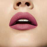 Maybelline Superstay Matte Ink liquid lipstick in muted rosy nude, shown as a smooth matte finish on the lips.