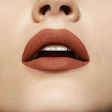 Maybelline Superstay Matte Ink liquid lipstick in warm terracotta nude, shown as a smooth matte lip color