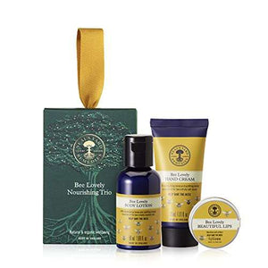 Neal’s Yard Remedies Bee Lovely Nourishing Trio gift set with body lotion, hand cream, and lip balm in green packaging