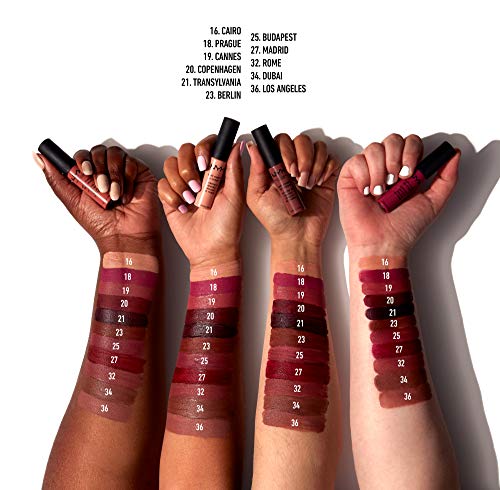 NYX Soft Matte Lip Cream held in hands with applicators and numbered Cannes shade swatches across varied skin tones