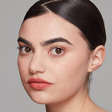 NYX Soft Matte Lip Cream shown as coral-pink matte color on lips, with a soft velvety finish.