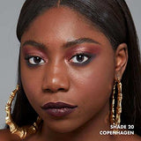 NYX Soft Matte Lip Cream shown as deep plum lipstick on lips, with shimmering rose eye makeup and gold earrings