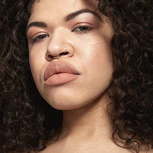 NYX Soft Matte Lip Cream in a muted peachy nude shade, shown on lips with a smooth matte finish