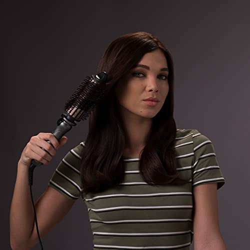 Woman styling hair with Remington Keratin Protect Hot Hair Brush