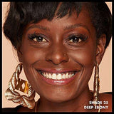 Total Control Foundation shown on smiling model with a deep ebony complexion and glossy lips, labeled shade 25
