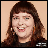 Total Control Foundation shown as a natural-looking makeup finish on a smiling woman, labelled shade 03 Porcelain.
